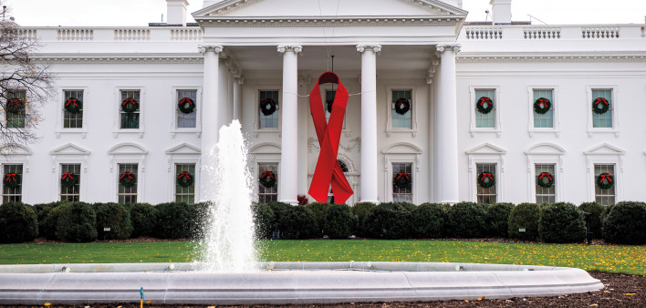 White House hangs red ribbon for World AIDS Day - CBS News