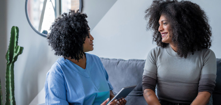 two women talking and laughing