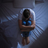 depressed young man in bed dark depresssion isolation