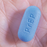 and hold blue pill with PrEP written