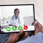 Close-up Of African Person Holding Blank Digital Tablet