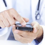  a doctor touching a smart phone