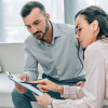 counselor and patient  reviewing info on clipboard