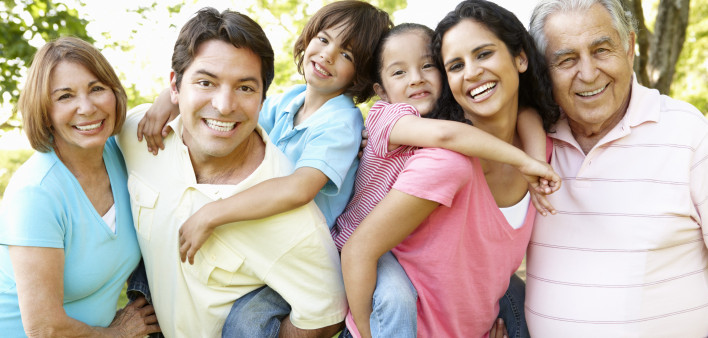 A multi-generational latin family having fun outdoors
