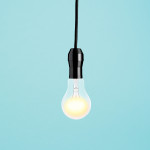 bare lit lightbuld in socket hanging