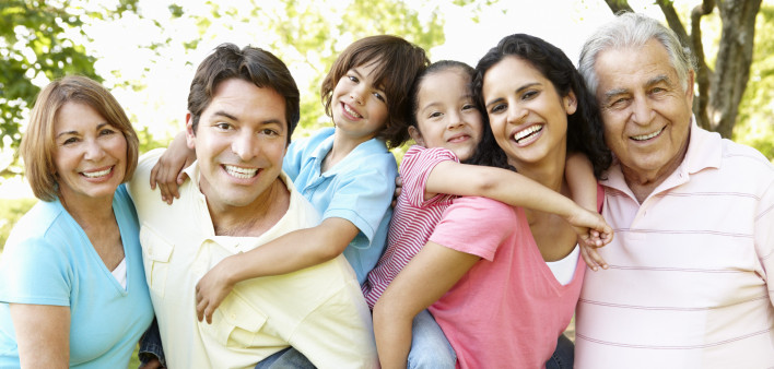 A multi-generational latin family having fun outdoors