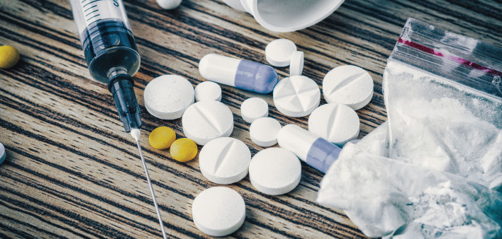syringe and pills