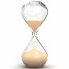 an hourglass with sand running downwards
